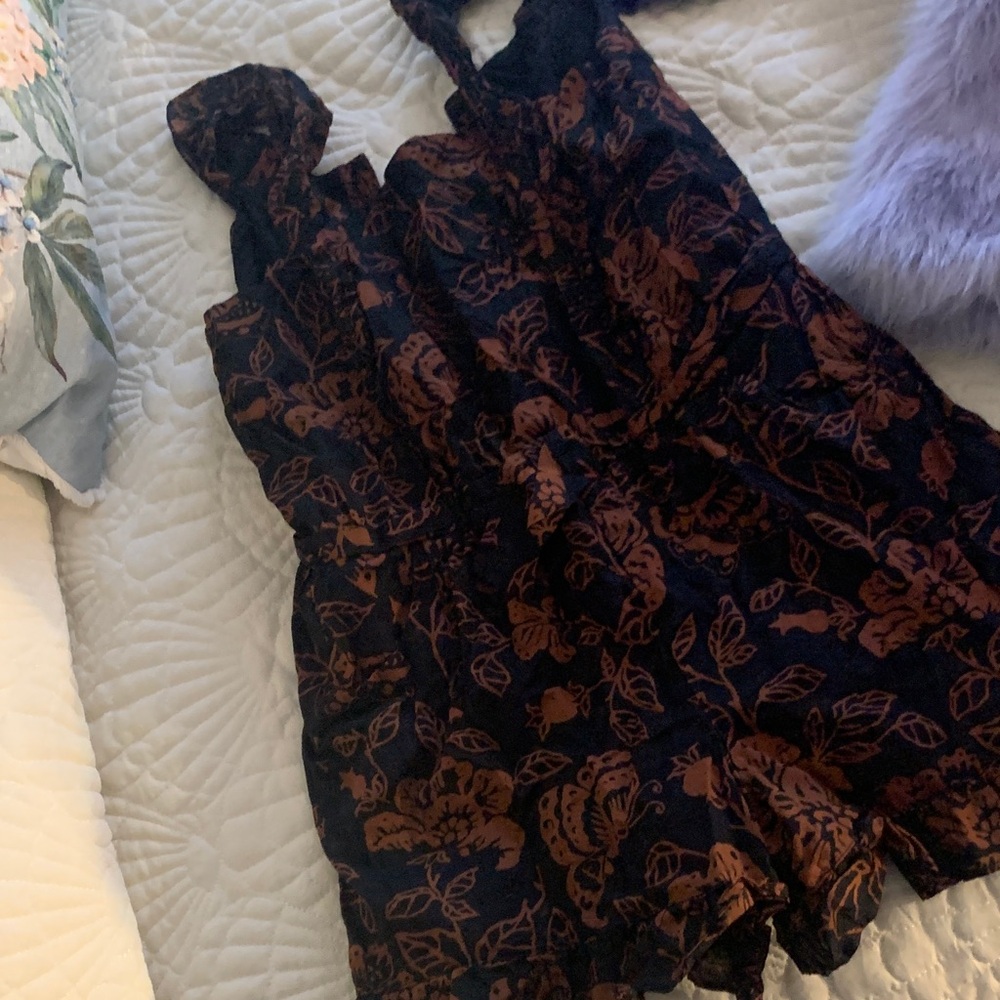 Janie and Jack Black Romper with Brown Floral Design. Ruffle bottom hem & straps